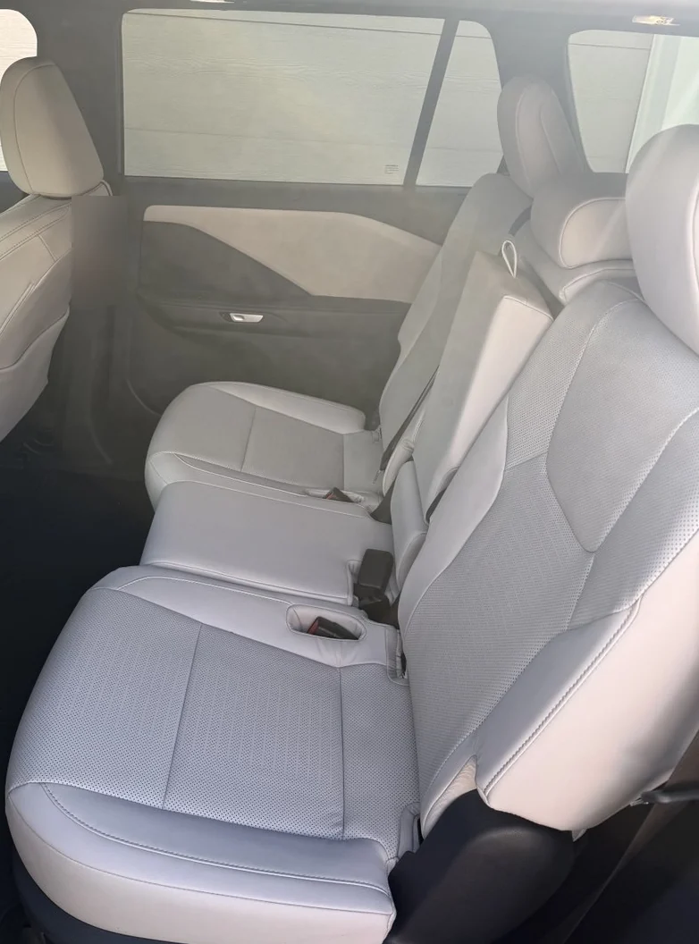 Light-colored passenger seats inside the Lexus TX 350 AWD