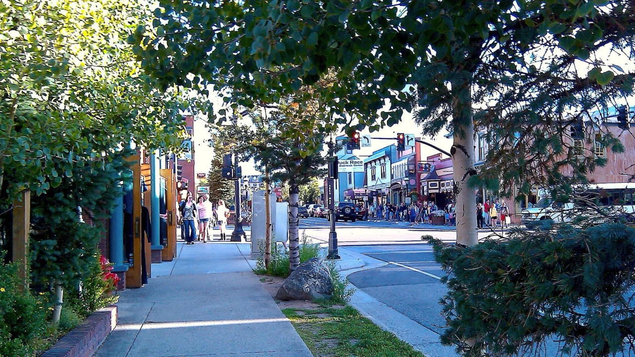Main Street in Breckenridge, Colorado, lined with colorful shops and trees
